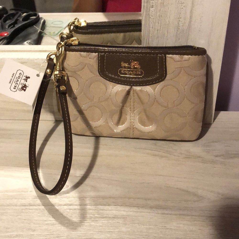Khaki/beige Coach wristlet. NWT.